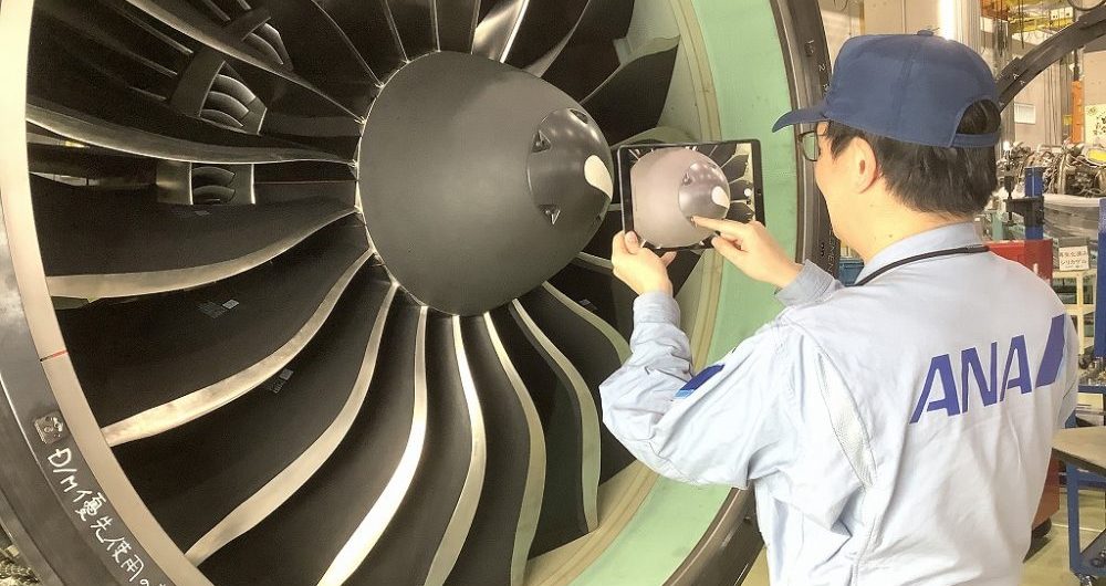 An aircraft technician at ANA Engine Technics receives expert guidance by means of CareAR as implemented by CBA, showing how technology can make it easier to show hospitality in customer service