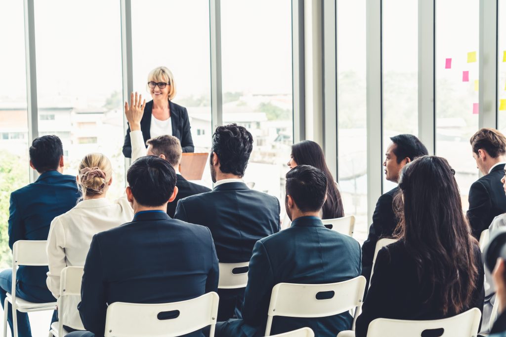 Contact Center Agents in a meeting room taking part in an effective training program to upskill them for customer service success