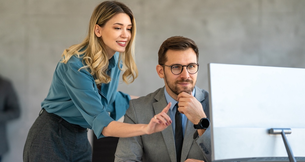 A skilled trainder provides instruction on new skills, illustrating one of the main ways to implement AI without making agents anxious