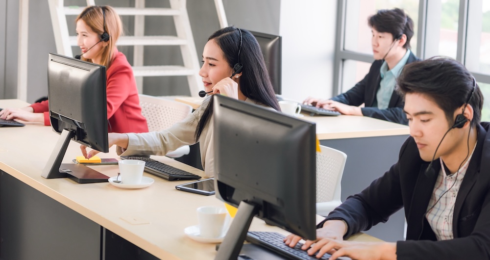 Three customer service agents in a contact center, helping customers in an effective way